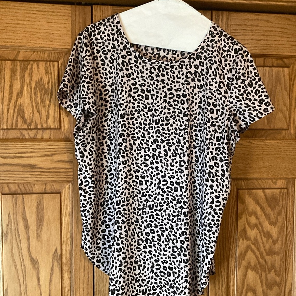 Ann Taylor blouse size medium. Black print on an “almost soft pink” background.